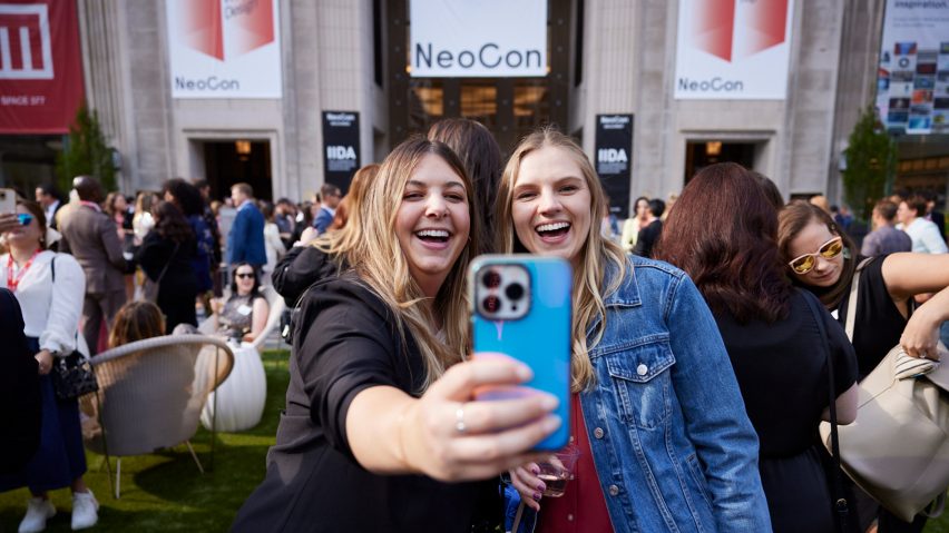 Photo of people taking a photo at NeoCon 2024