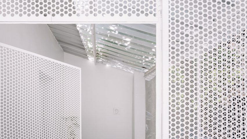 Perforated metal screen wall with doorway