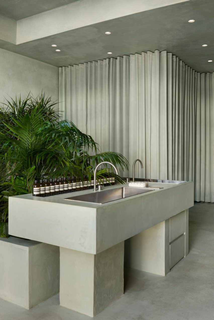 Stainless steel sinks within green microcement counter
