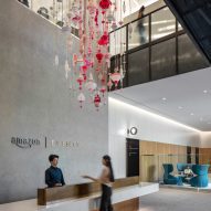 A pink glass sculpture in an Amazon lobby