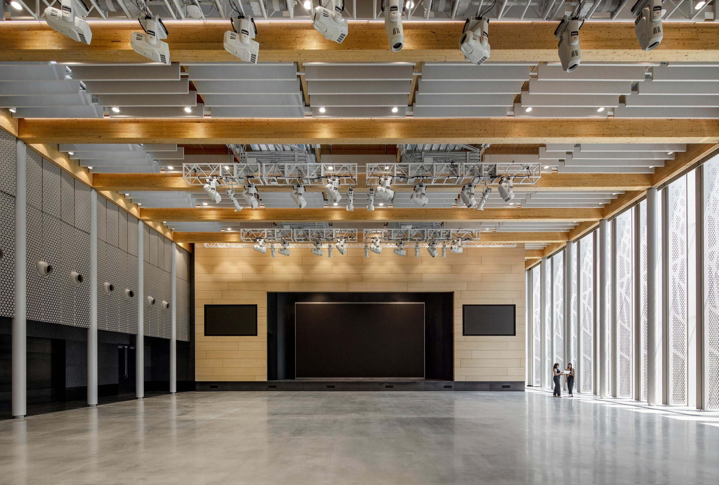 A event center with a large screen and window louvres at Amazon