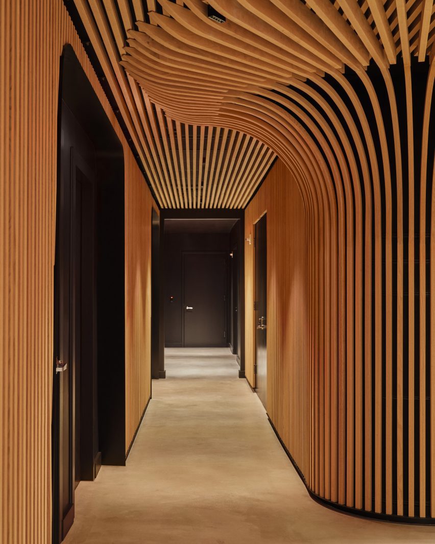 Corridor enveloped in oak battens