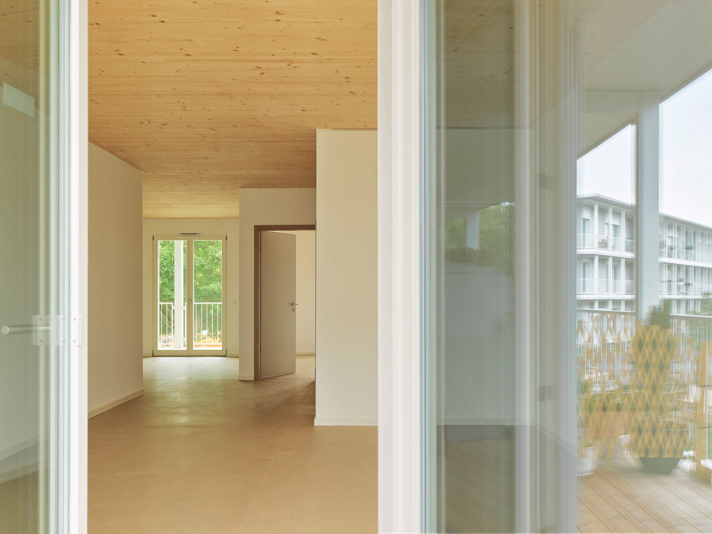 Room with cross-laminated floor and ceilings in a multi-generational housing project