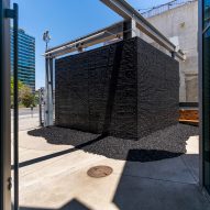 Tar-like pavilion created to challenge notions of blackness in design