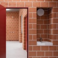 Gardeners workshop interior with red doors and terracotta brick walls