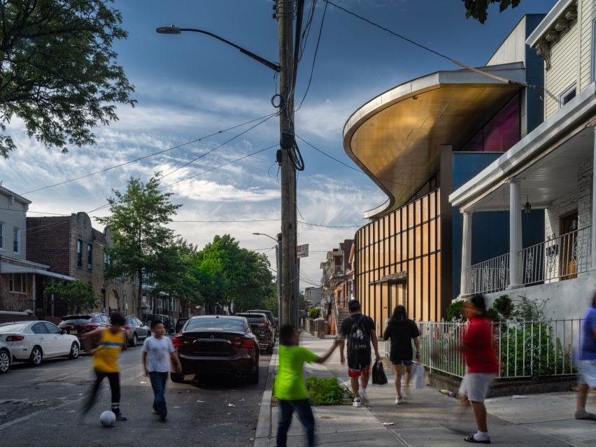 Swooping gold canopy on the Louis Armstrong Center in Queens