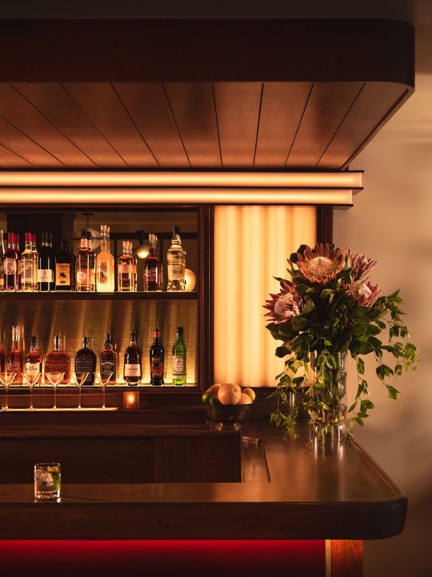 Bar corner with wood panelling and custom lighting