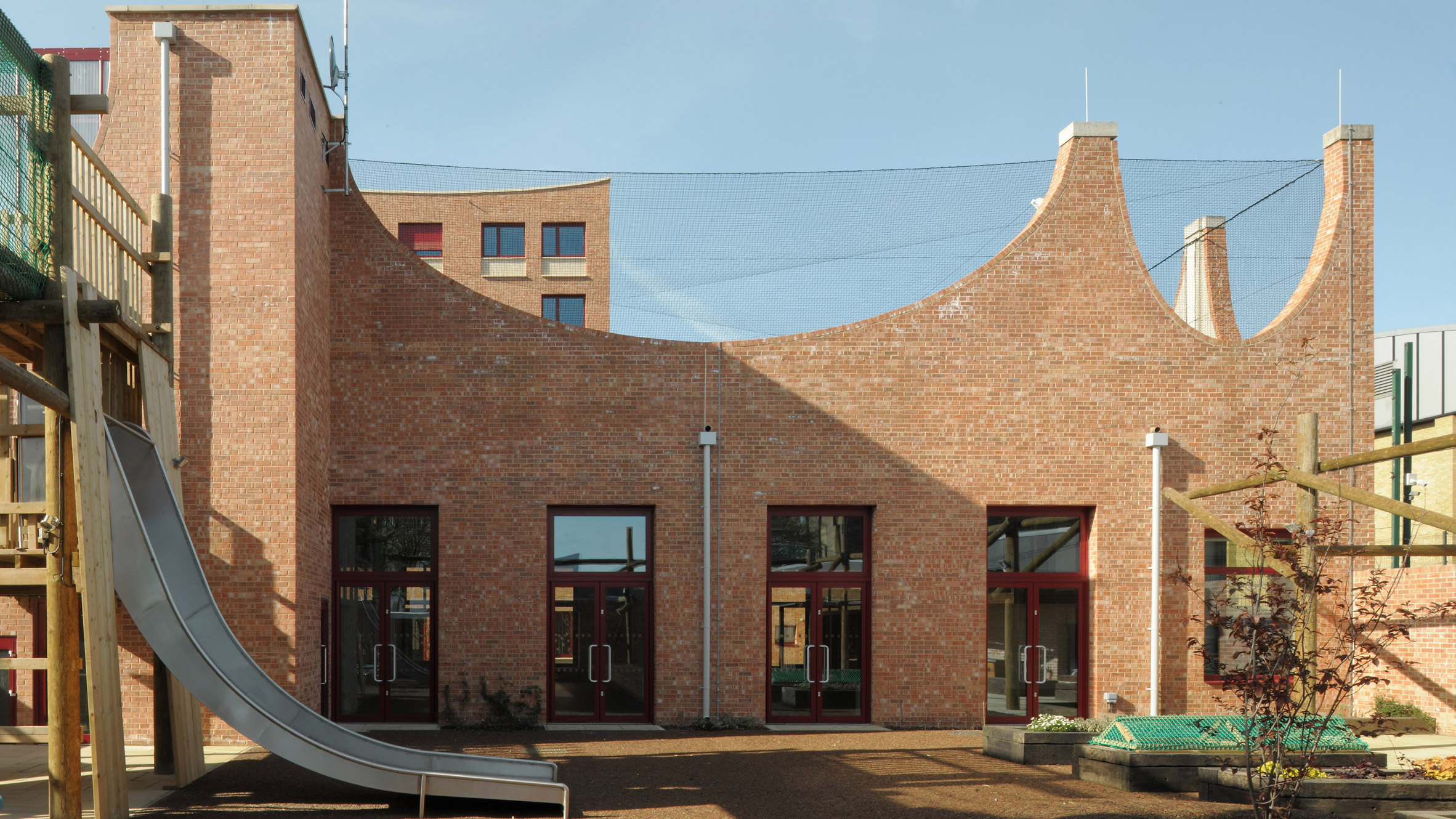 Arched forms enliven Central Somers Town children's centre - Vimarsana News