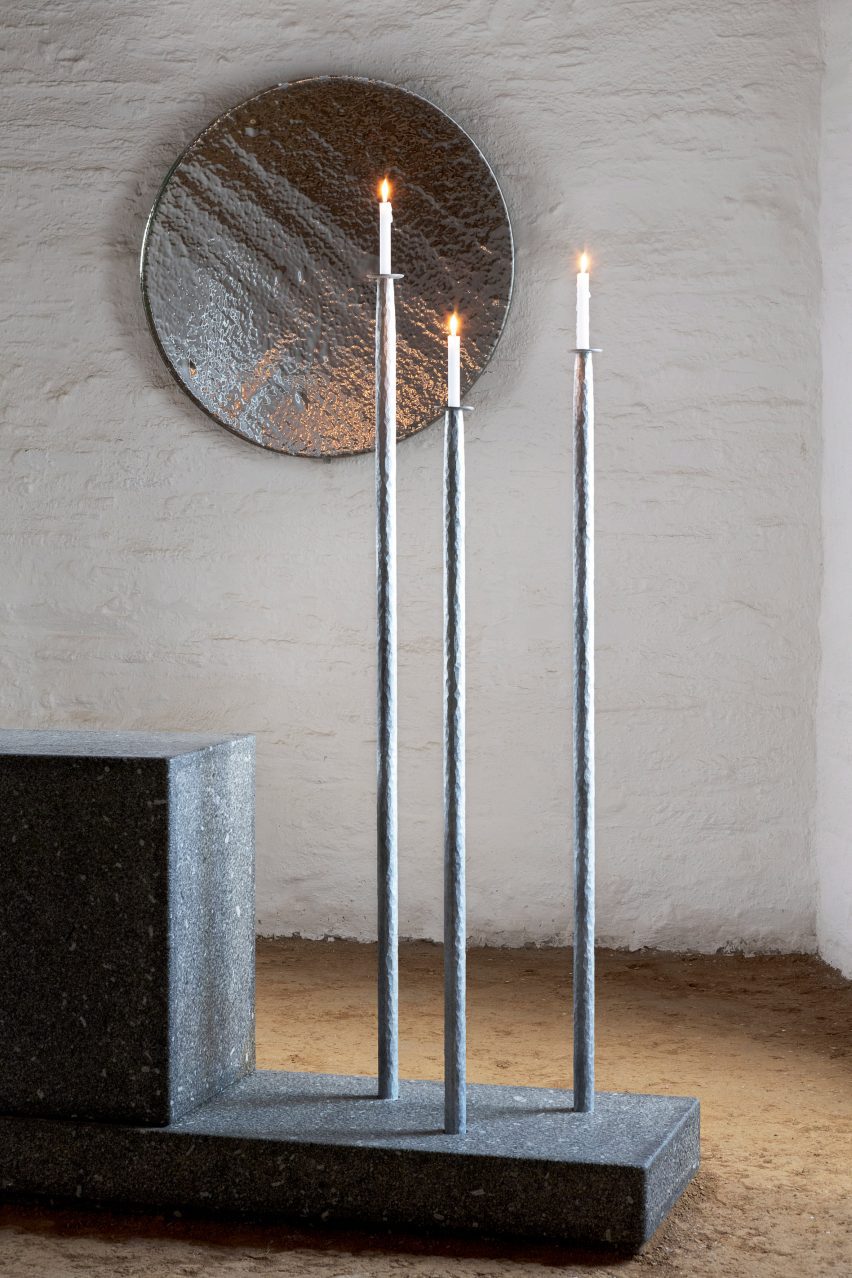 Steel candle holders inside chapel interior by Ronan Bouroullec