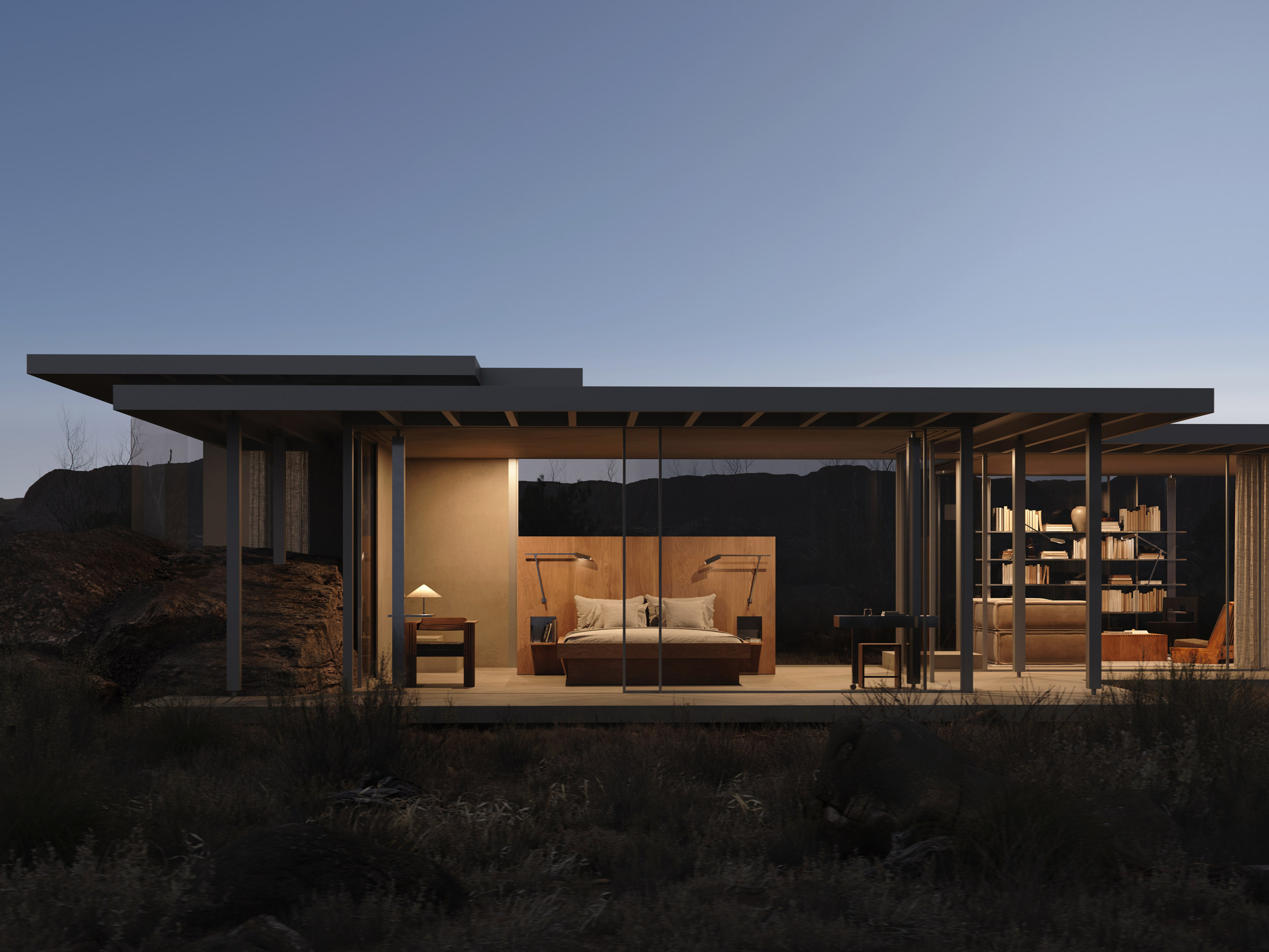 Modernist house at night in the Utah desert with floor-to-ceiling glazing