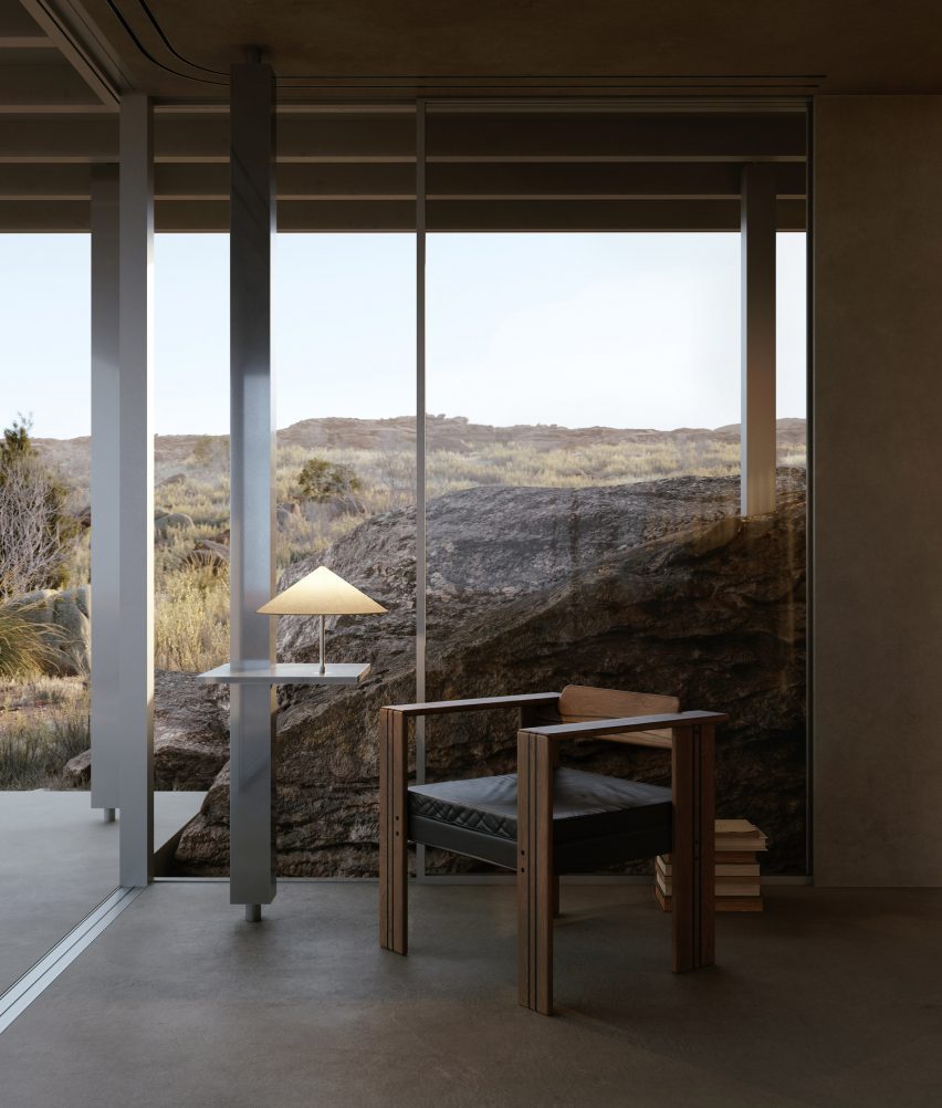 Interior with an armchair and views of a desert landscape