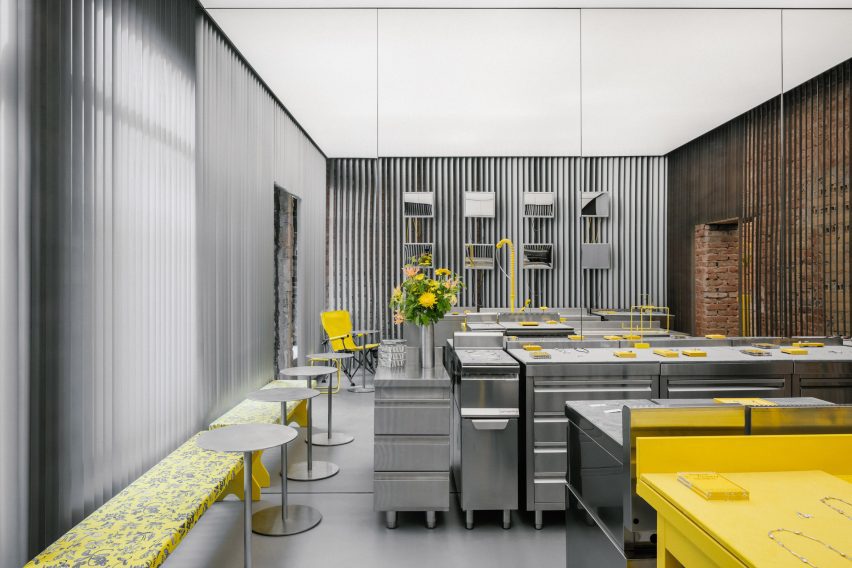 Interior with stainless steel furniture and yellow sink