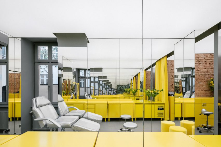 Store interior with stainless steel furniture and yellow sink