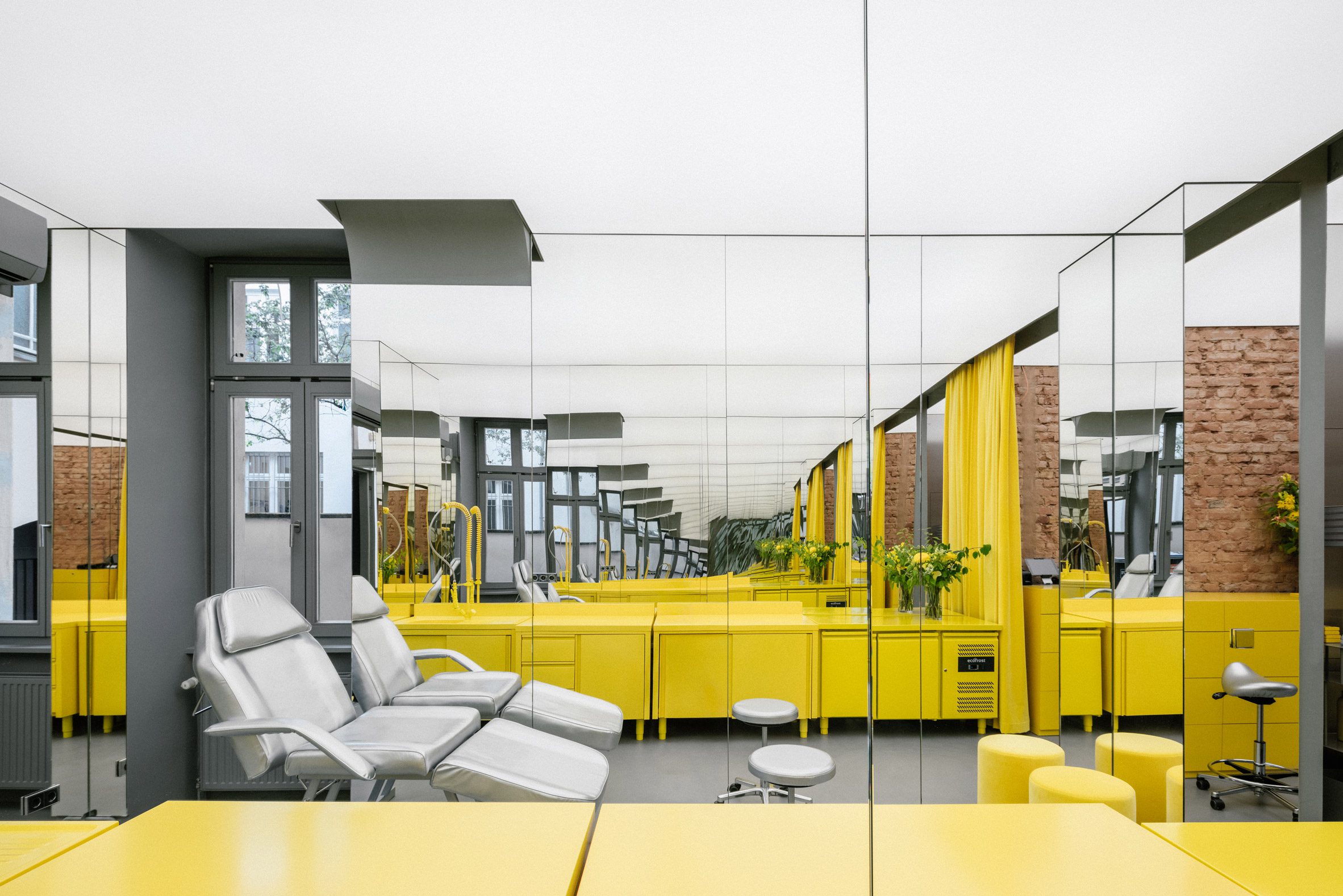 Store interior with stainless steel furniture and yellow sink