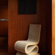 Wiggle Chair by Frank Gehry in a wood-lined interior