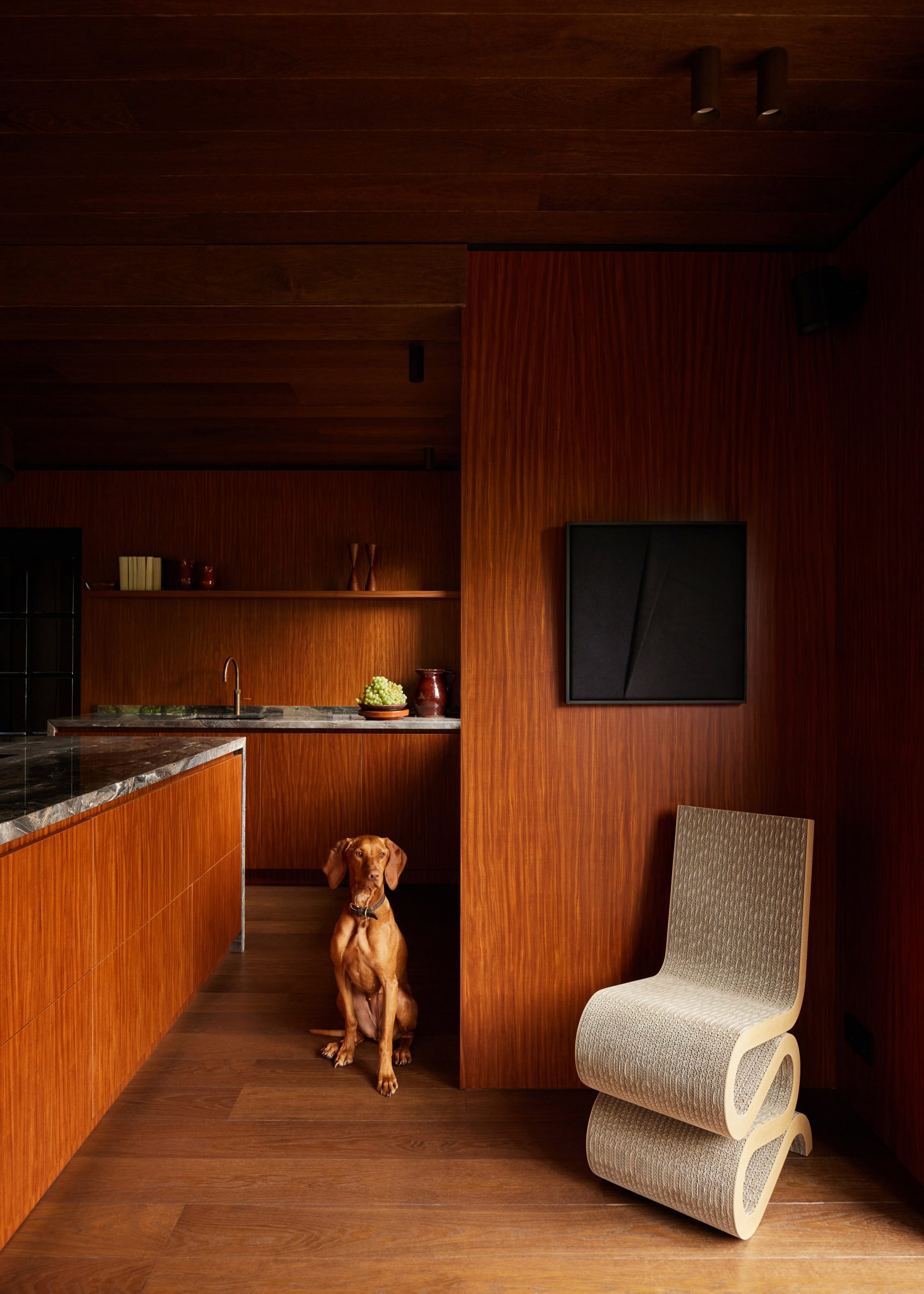 Kitchen interior by DAB Studio with wood-lined walls, floors and cabinets
