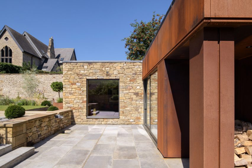 Stone and weathered-steel exterior of Hushh House