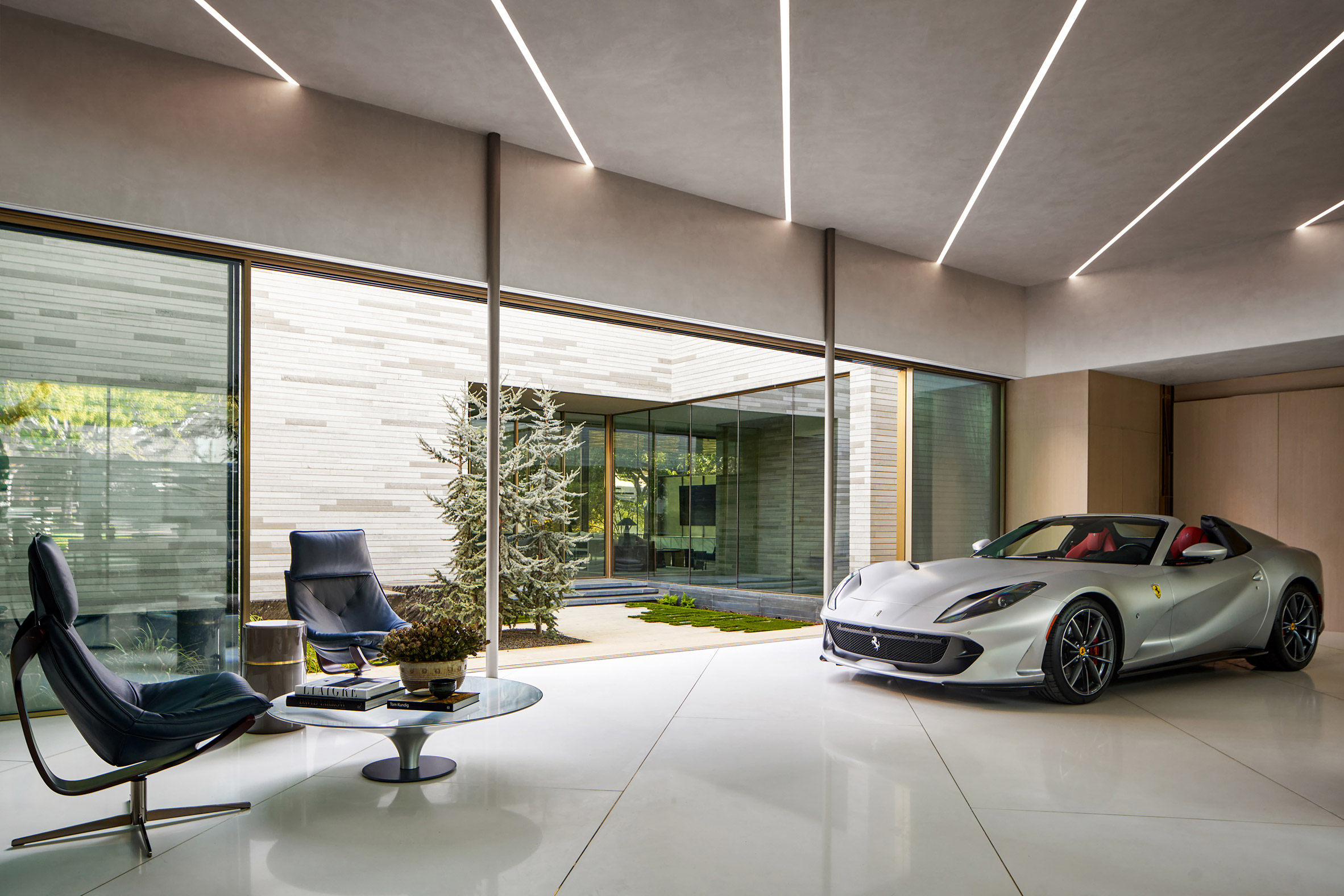 Gallery-like residential space with a Ferrari