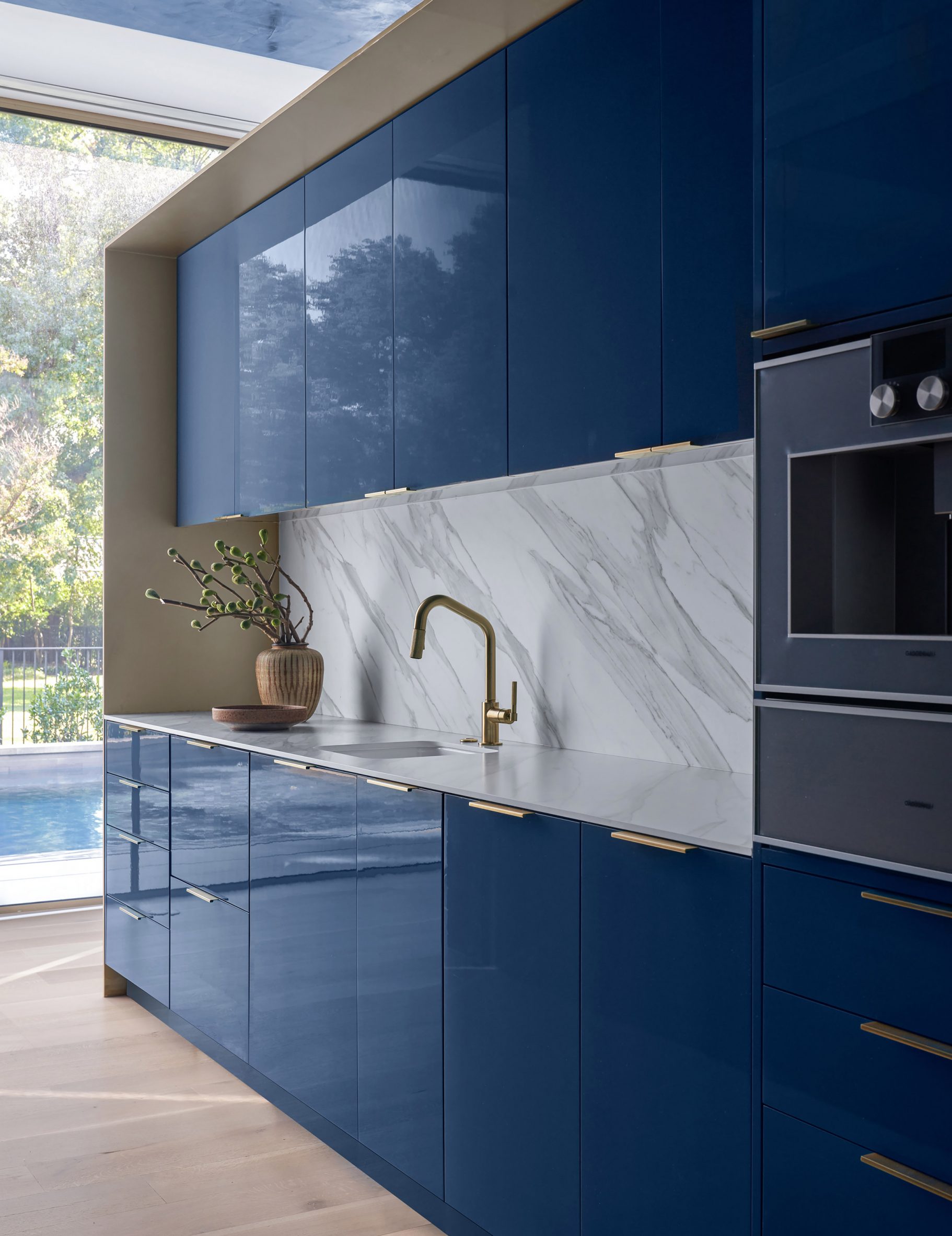 Blue lacquer-fronted cabinetry in Ferrari house