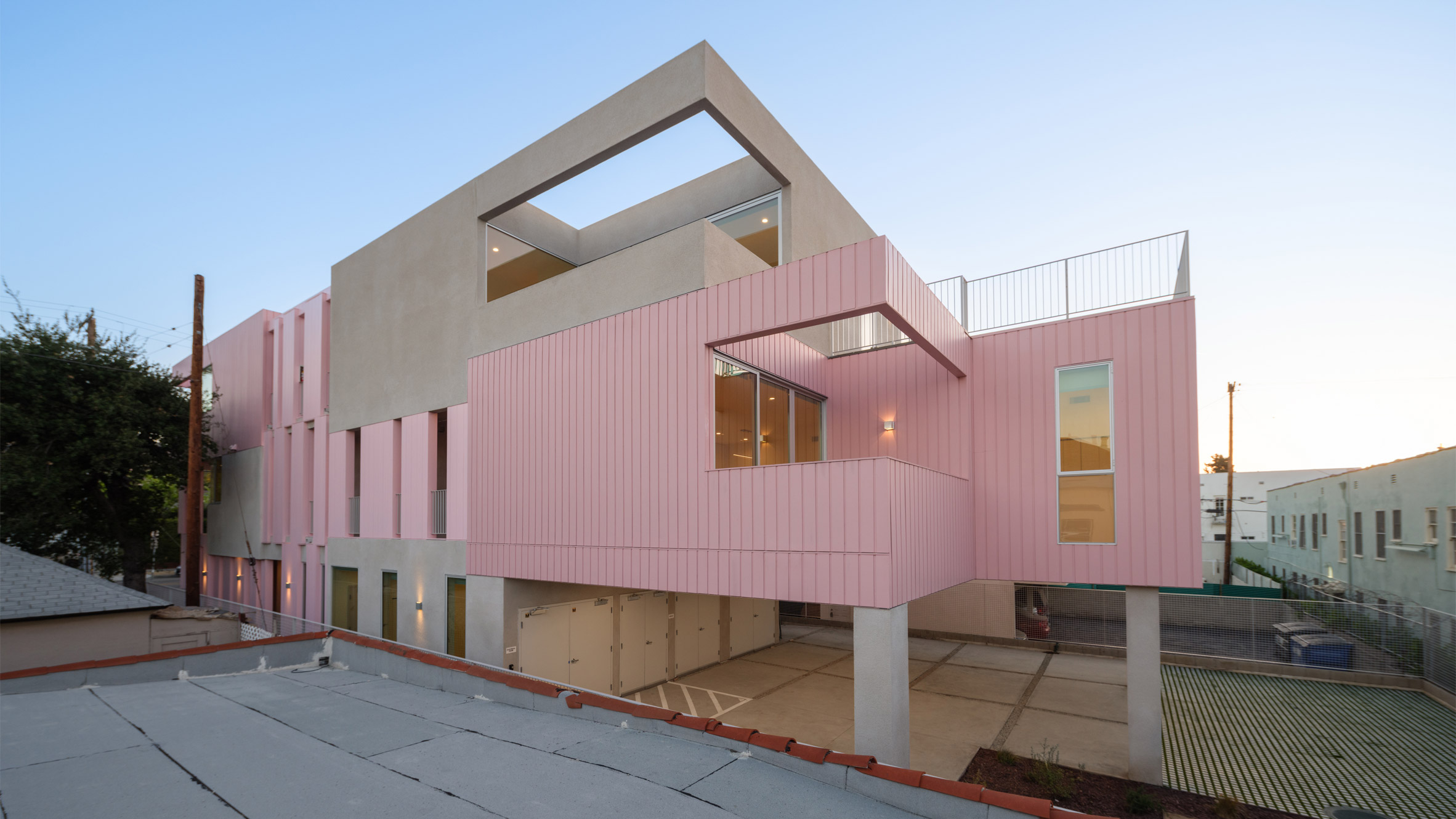 Yu2e draws on historic styles to create pink housing project in
