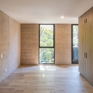 Interior space with concrete walls and timber flooring