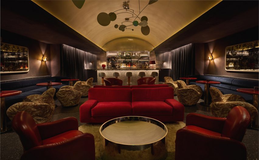 Dark bar lounge with a vaulted golden ceiling