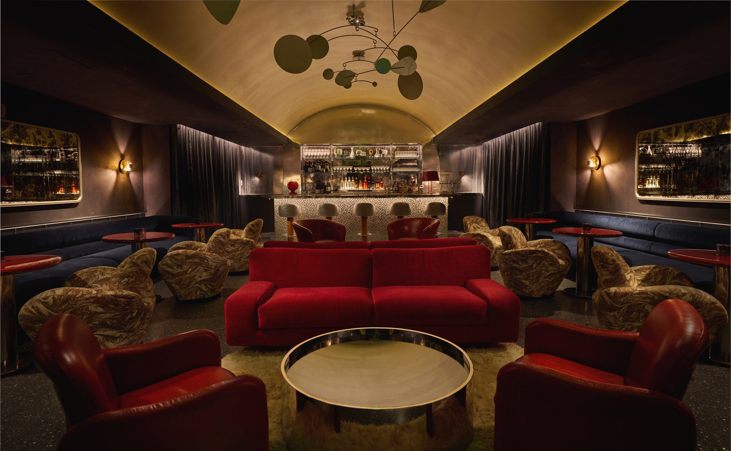 Dark bar lounge with a vaulted golden ceiling