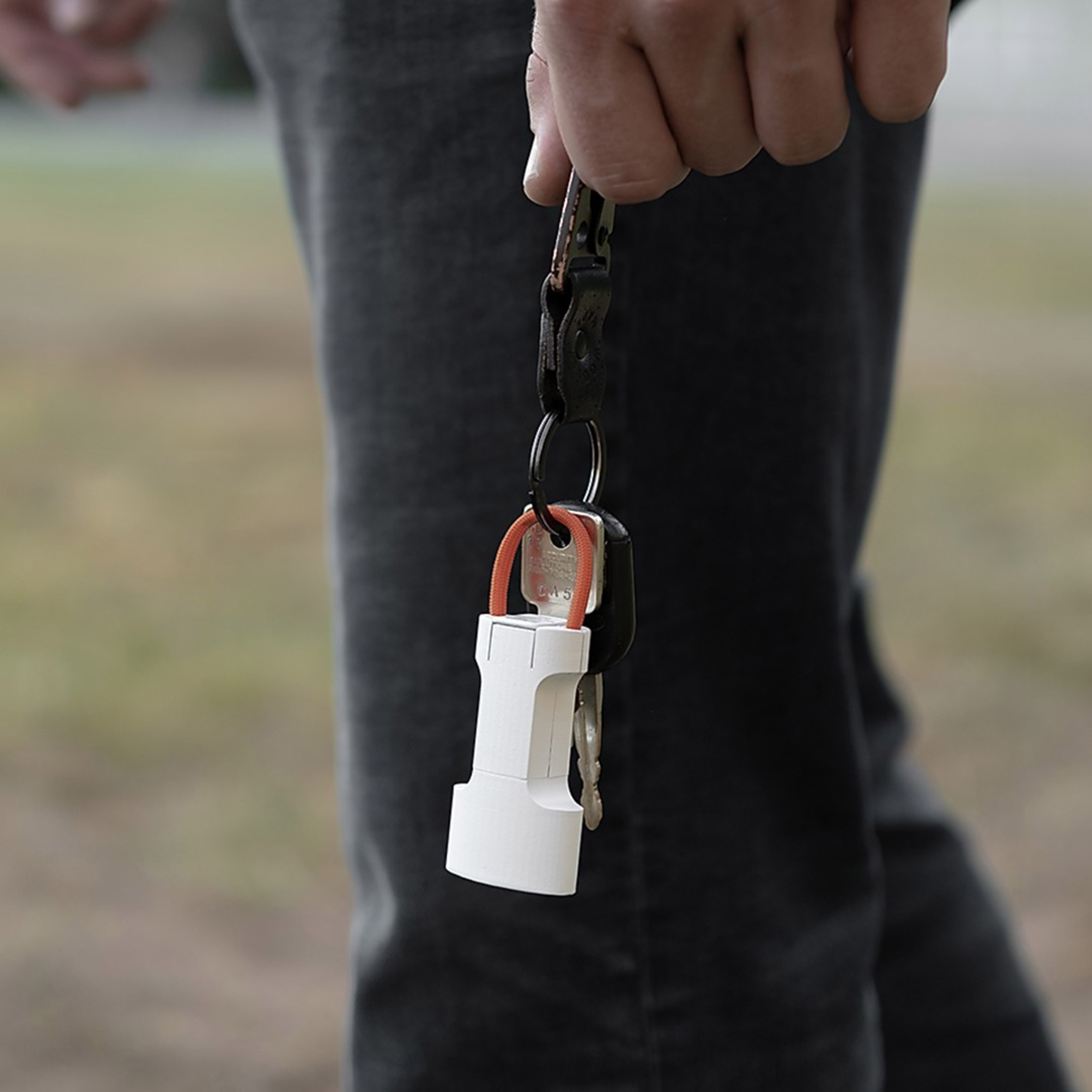 Portable naloxone administration device attached to a set of keys