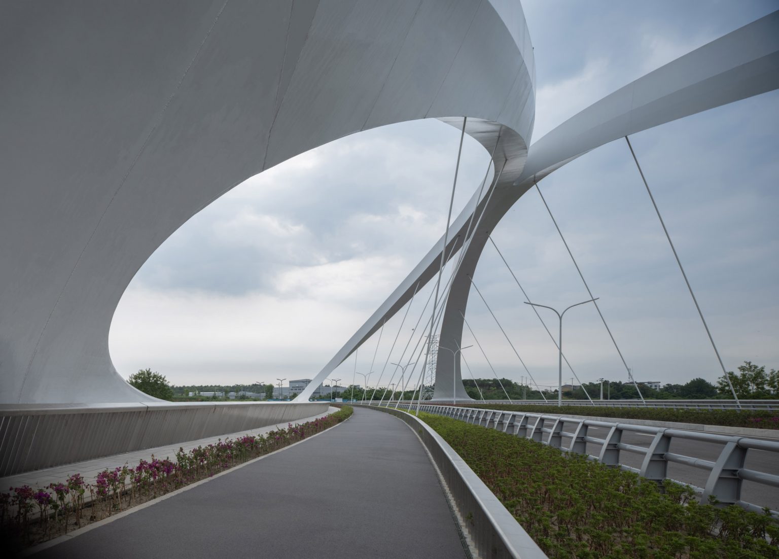 Sculptural steel arches support Jiangxi River Bridge by Zaha Hadid ...