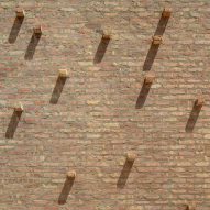 Extruded bricks in a brick wall