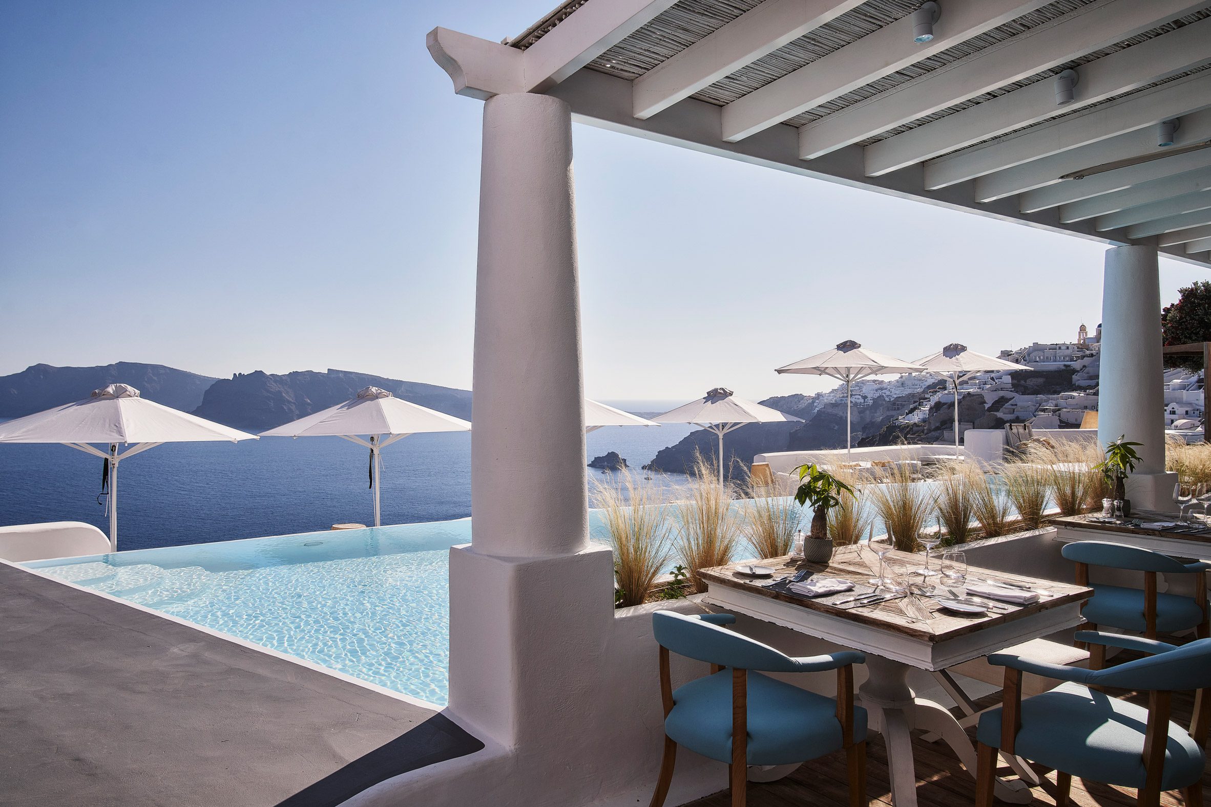 Restaurant overlooking infinity pool and caldera