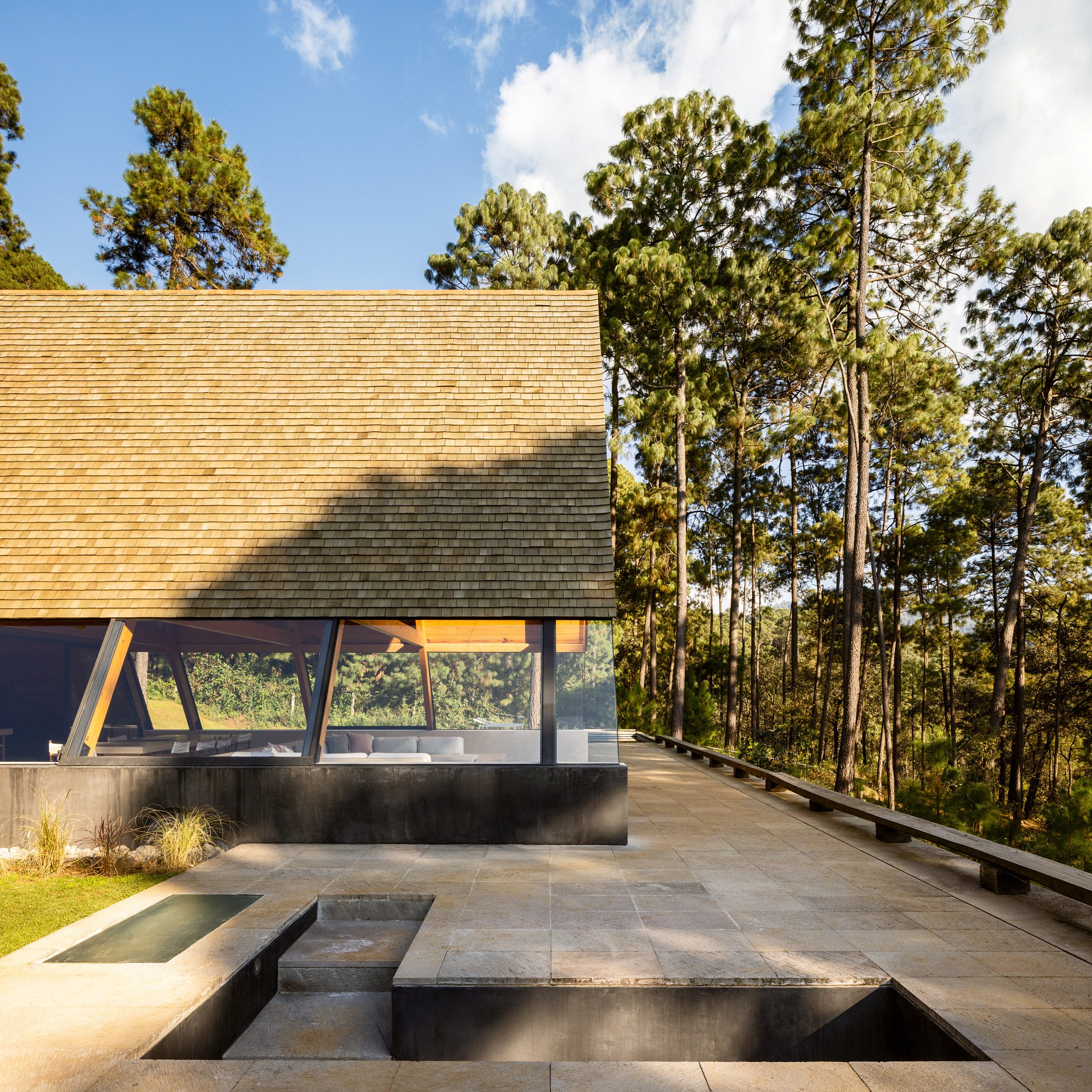 An A-Frame with a terrace overlooking the forest