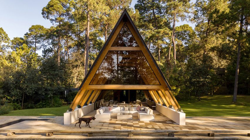 An open-air A-Frame pavilion with a living room and terrace