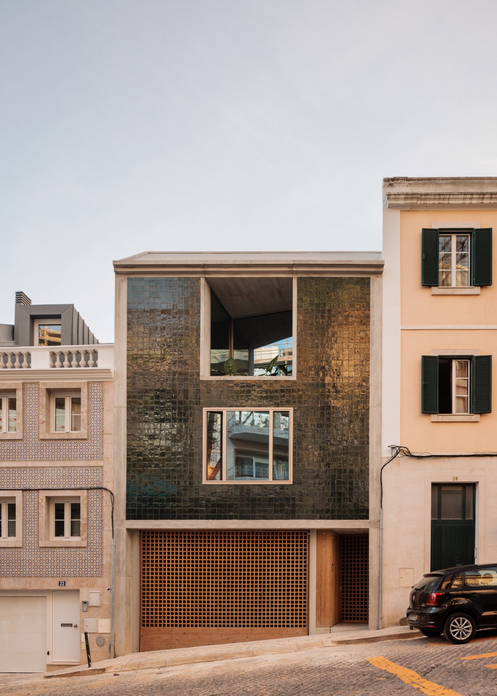 Concrete house decorated in green tiles in Lisbon by Bak Gordon Arquitectos