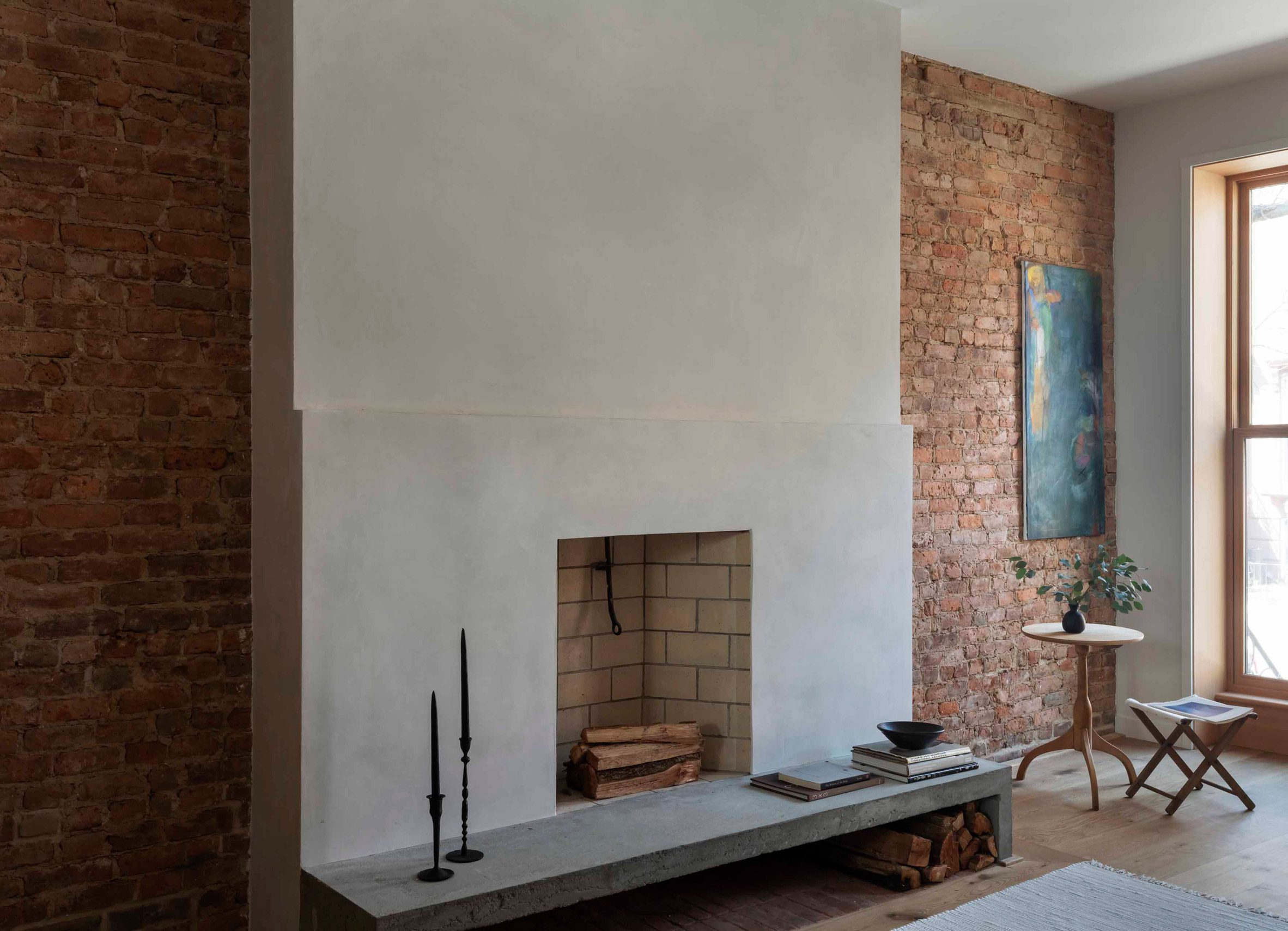 Brick wall and fireplace within Brooklyn townhouse by TBo