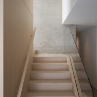 Timber staircase with a glass balustrade