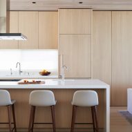 Kitchen with timber cabinets and a white island