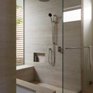 Walk-in shower with stone-like surfaces
