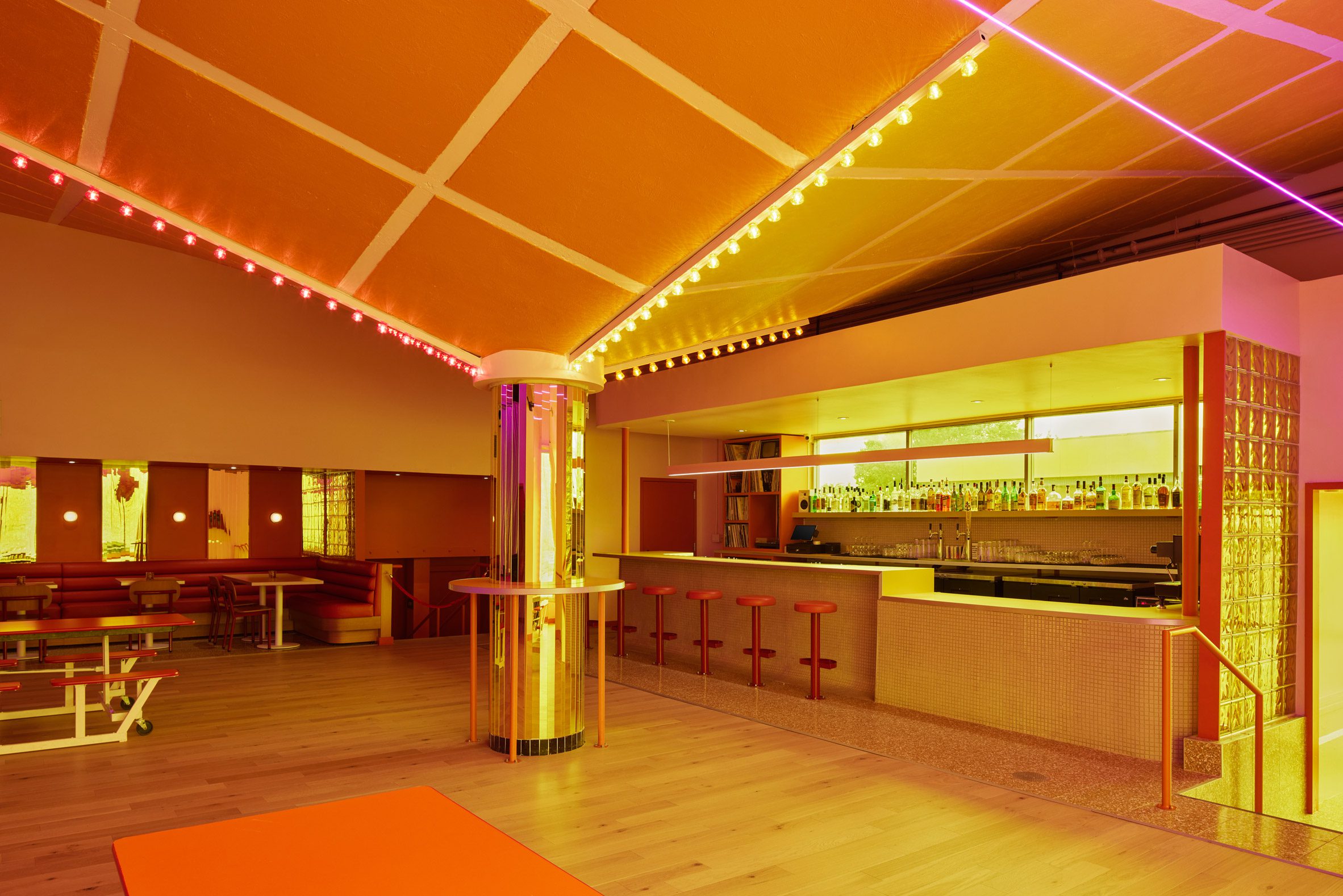 Nightclub with angled ceiling and central column