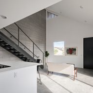 Open-plan kitchen and dining room with a mezzanine level above