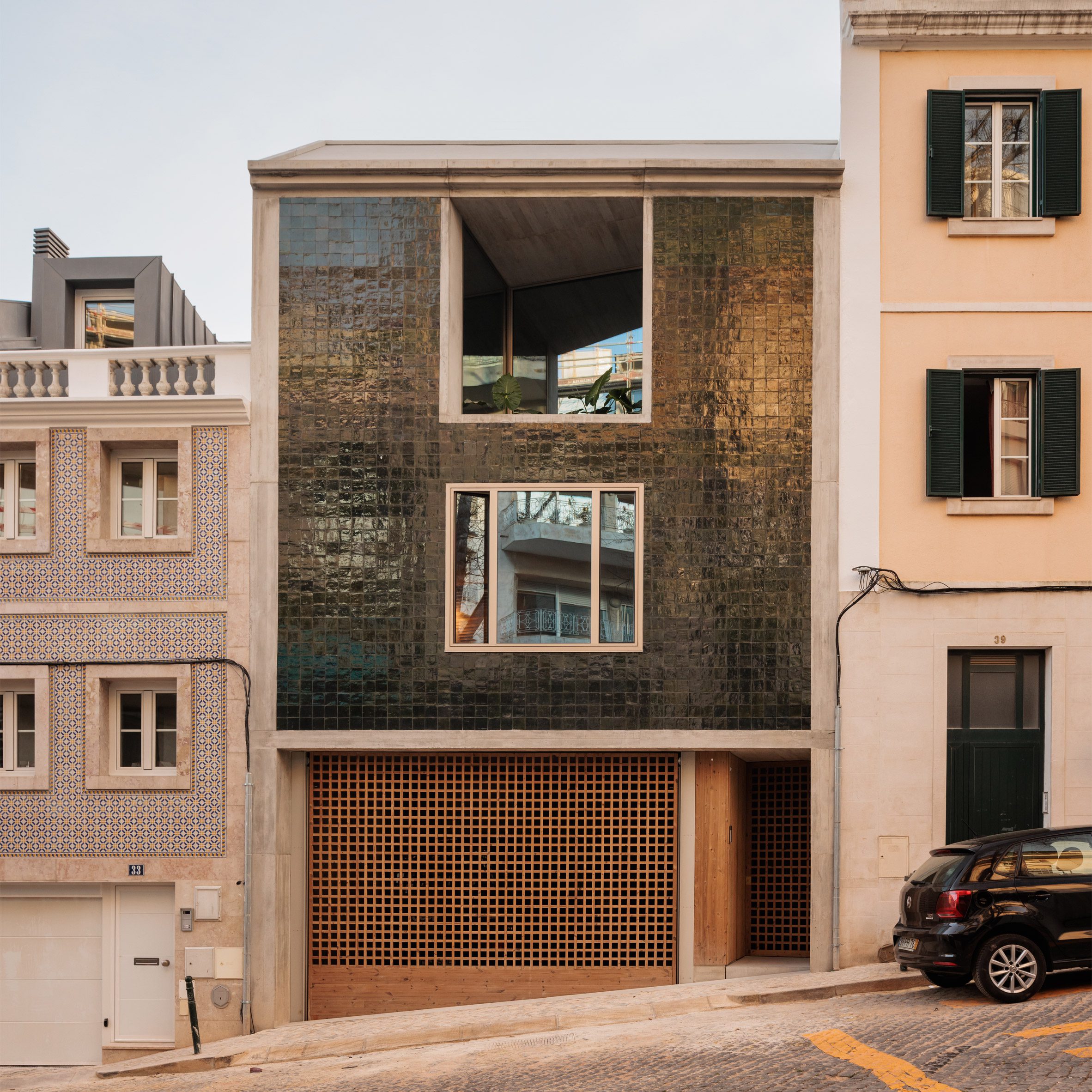 Concrete house decorated in green tiles in Lisbon by Bak Gordon Arquitectos