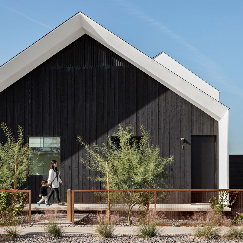 Gable end of a Phoenix house clad in black timber by SinHei Kwok