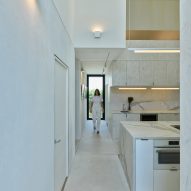 White marble kitchen with a concrete footpath