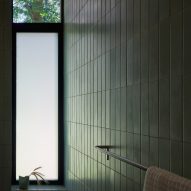 Bathroom with green wall tiles