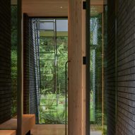 Wooden door leading to a the interior of The Rambler house by GO'C