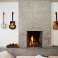 Living room with a concrete fireplace