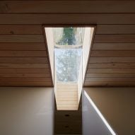 Rectangular skylight in a wood-panelled ceiling