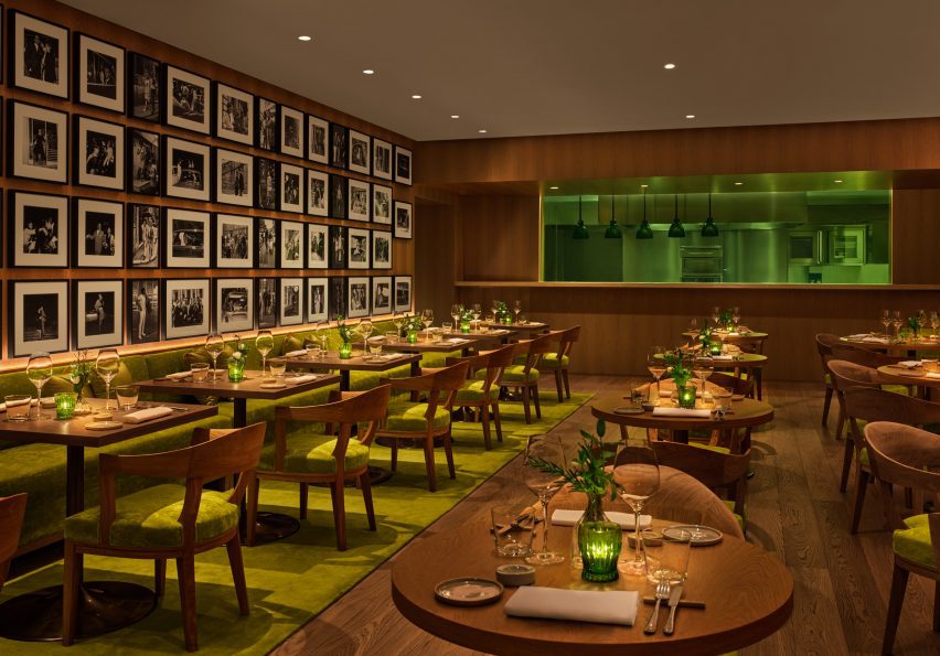 Restaurant with wooden furniture and chartreuse-coloured upholstery