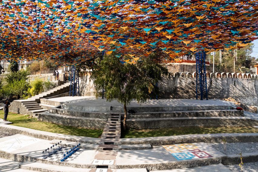 Stepped landscape covered by a colourful canopy by Studio Saar