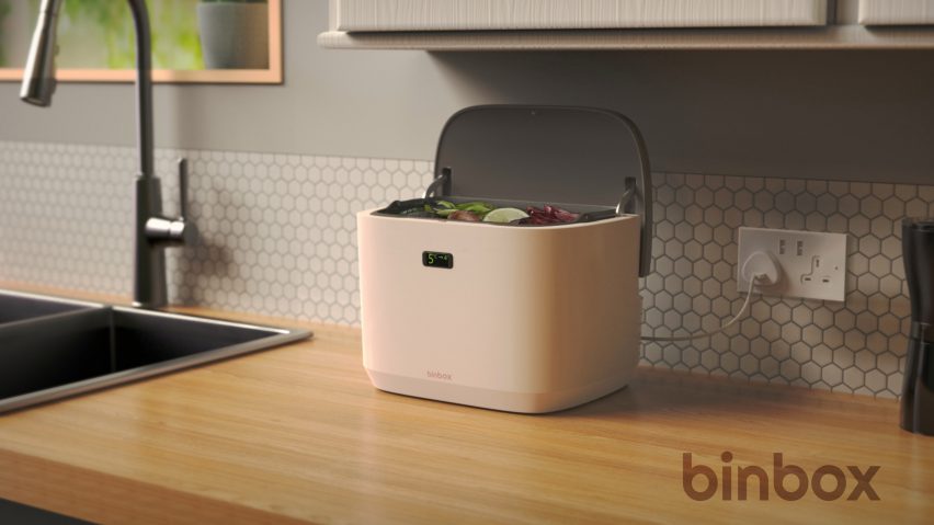 Pink food waste recycling bin on a kitchen counter